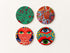 Set of 4 square cork coasters featuring colorful avant-garde polka dot and eye motifs inspired by Yayoi Kusama